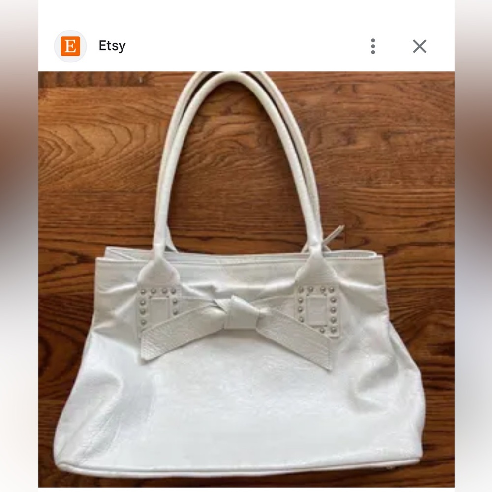 Roberta Gandolfi Italian leather bow detail handbag in an off-white color.